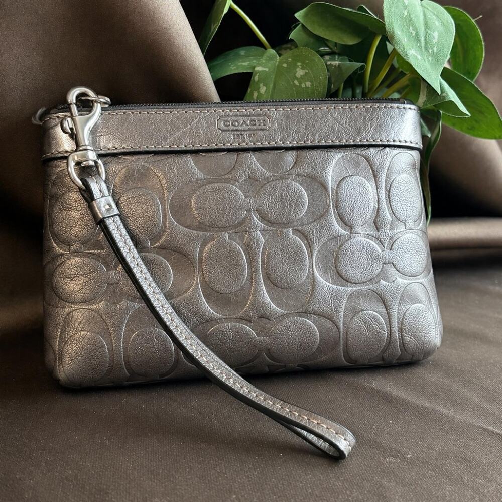 Coach silver metallic leather wristlet excellent condition